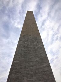 Low angle view of architectural column against sky