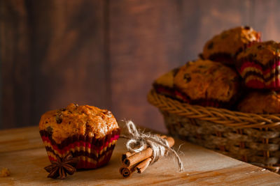 Delicious homemade muffins with raisins. christmas baking on a wooden background.