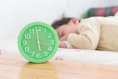 Close-up of a woman sleeping on bed