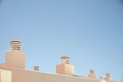 Low angle view of tower against clear blue sky