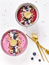 High angle view of breakfast served in bowls on table