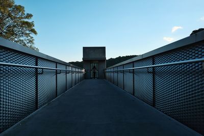 Low angle view of footbridge against clear sky