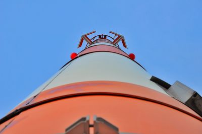 Low shot of red and white antenna of maintower