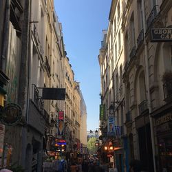 Low angle view of illuminated buildings against sky