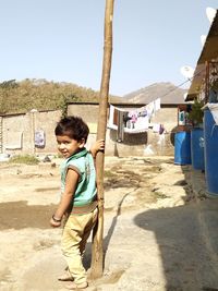 Full length of boy on land against clear sky