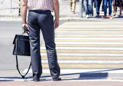 Low section of people crossing road