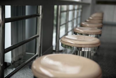 High angle view of empty chairs and table in restaurant