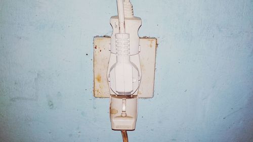 Close-up of electric lamp on wall