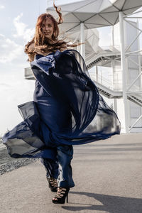 Full length portrait of young woman