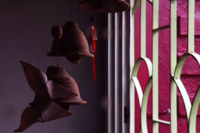 Close-up of craft product hanging by window at home