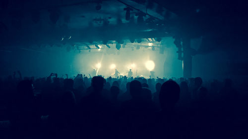 Silhouette people at music concert