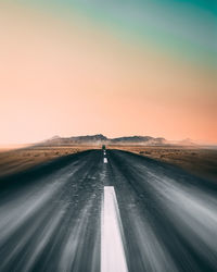 Road amidst landscape against clear sky