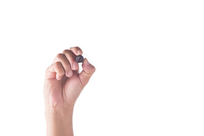 Close-up of human hand over white background