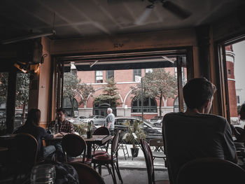 Rear view of people sitting in restaurant