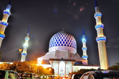 Illuminated blue mosque at night