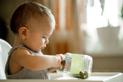 Close-up of cute baby boy at home