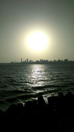 Scenic view of sea against clear sky during sunset