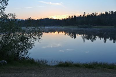 Scenic view of lake at sunset