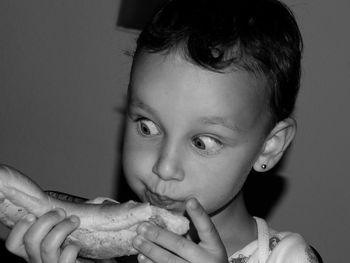 Close-up portrait of girl eating food