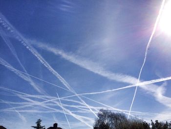 Low angle view of vapor trails in sky