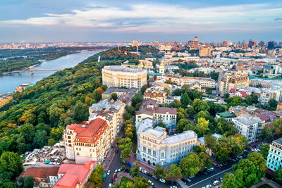 High angle view of buildings and trees against sky