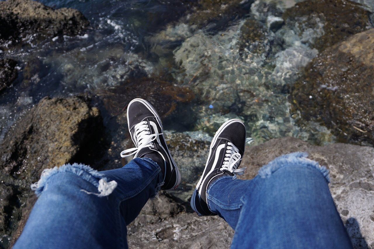 shoe, human body part, human leg, low section, personal perspective, lifestyles, leisure activity, standing, water, outdoors, one person, canvas shoe, day, close-up, people, adult