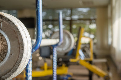 Close-up of barbell in gym