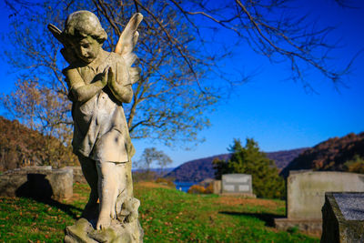 Statue against blue sky