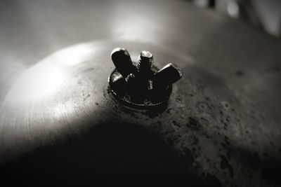 Close-up of electric lamp on table