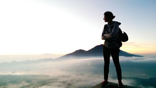 Silhouette of woman standing on landscape