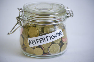 Close-up of coins in jar