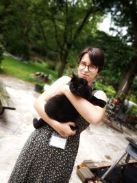 Full length of young woman holding hands