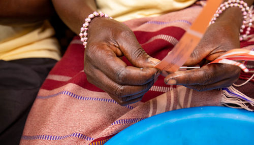 Midsection of woman holding hands