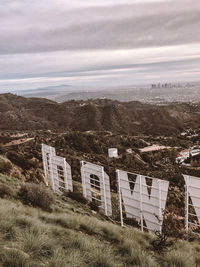 High angle view of buildings on field against sky