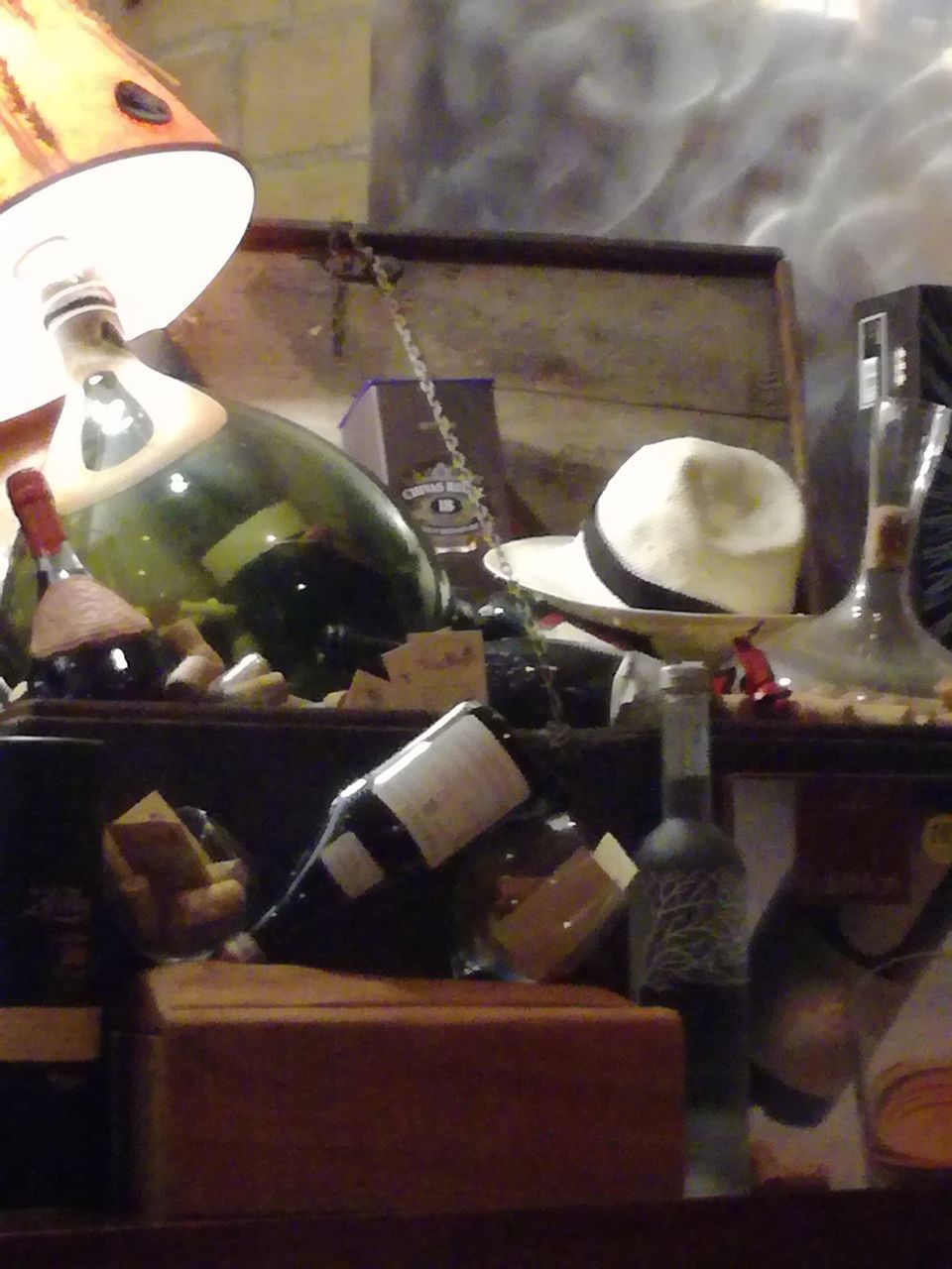 CLOSE-UP OF WINE BOTTLES ON TABLE