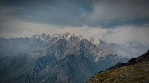 Scenic view of snowcapped mountains against sky