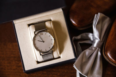 High angle view of clock on table