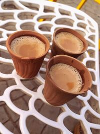 High angle view of coffee served on table