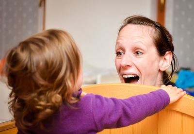 Portrait of mother and daughter at home