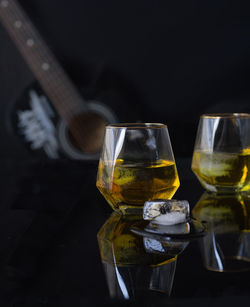 Close-up of wine glasses on table