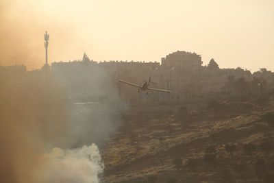 Air tractor at-802 fire fighting aircraft extinguishing a fire