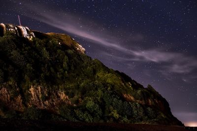 Low angle view of mountain against sky at night