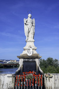Statue against blue sky