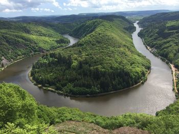 High angle view of river amidst green landscape