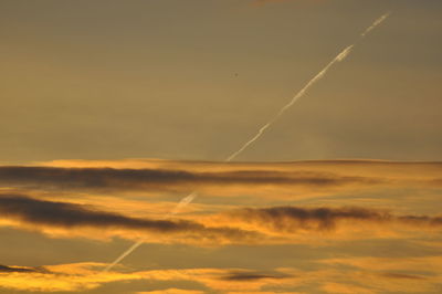 Low angle view of vapor trails in sky