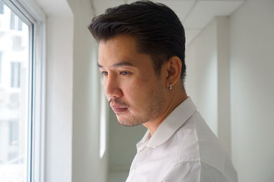 Portrait of young man looking away