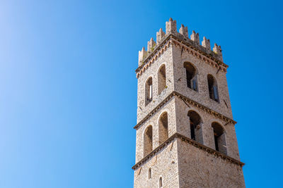 Low angle view of building against blue sky