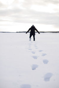 Person walking through snow