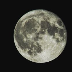 Low angle view of moon against sky at night