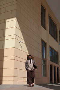 Businessman walking outside building